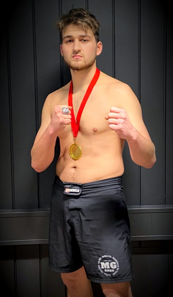 Champion posing with competition medal