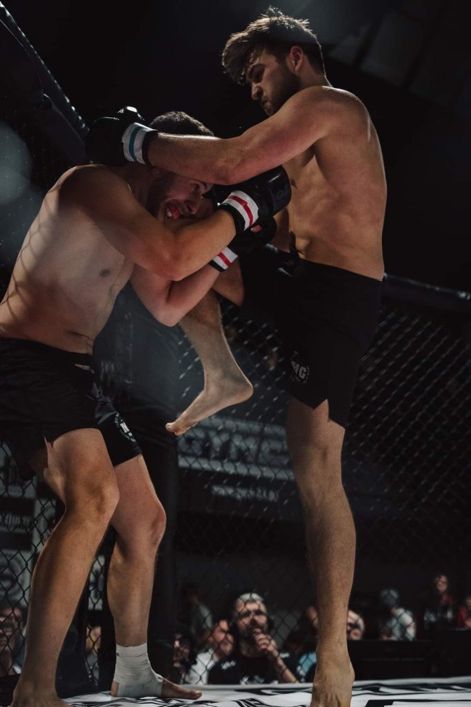 Fighter showing medal after competition |