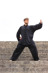 Rooted Tai Chi stance with focused eyes